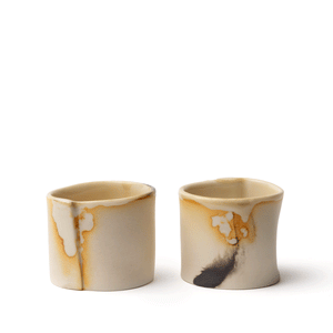 Sunlit cream anything cup made by OXUM NYC, part of the handmade ceramic home accessories collection. A vessel for sake or tea. But wait, there's more! It also makes a fantastic tea light holder, a practical medicine cup, and a stylish jewelry holder. The possibilities are endless!