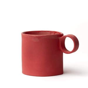 Red mug made by OXUM NYC, part of the handmade ceramic home accessories collection. With its signature seam, cute dimples, a glossy glaze interior, and a matte exterior. It is a sight to behold!