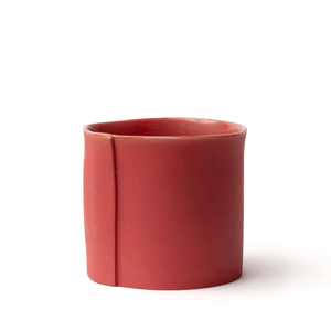 Red tumbler made by OXUM NYC, part of the handmade ceramic home accessories collection. Perfect for wine, spirits, and those fancy on-the-rock drinks. With a signature seam that screams, "I'm special, la la la." And don't forget about its thumb dimple, which is perfect for a comfy hold. The matte exterior adds a touch of earthiness, The glossy glaze shines like a superstar.